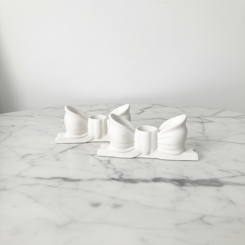 Bow candle holders on marble